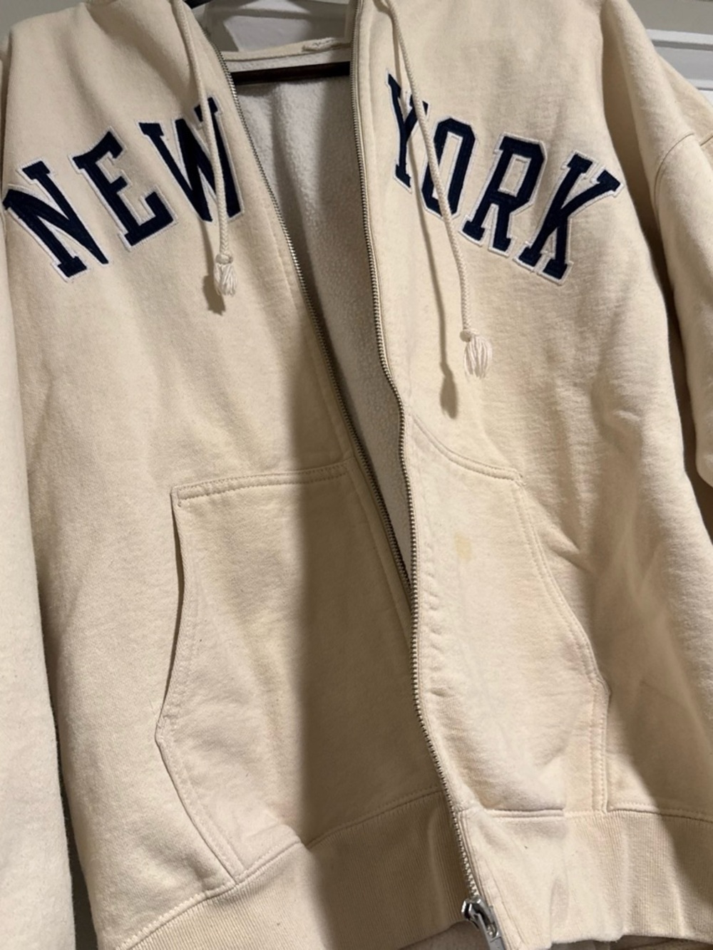 Brandy Melville Cream New York Zip-Up Hoodie with Navy Lettering (broken zipper)